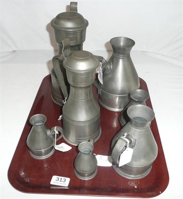 Lot 313 - Two pewter lidded jugs and a set of five graduating pewter measures