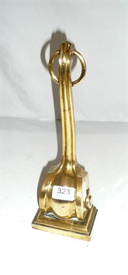 Lot 323 - Brass door porter