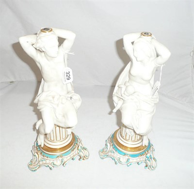 Lot 329 - A pair of figural comport stands, unknown factory, circa 1860, the dishes now lacking, modelled...