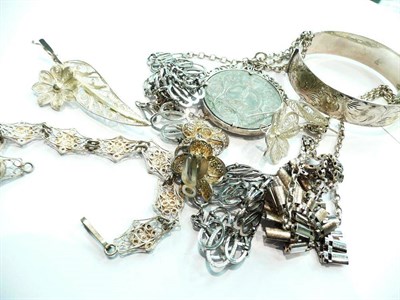 Lot 370 - A silver bangle, two necklaces, a coin pendant on chain, three filigree brooches, a pair of...