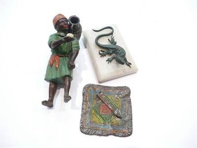 Lot 407 - Cold painted bronze carpet seller and lizard paperweight