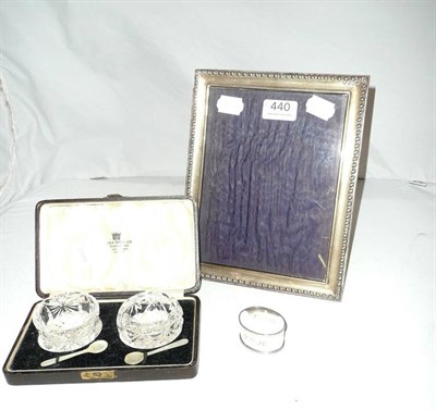 Lot 440 - Silver photograph frame, silver napkin ring and a cased pair of glass salts with...