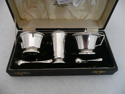 Lot 443 - A silver three piece cruet, cased