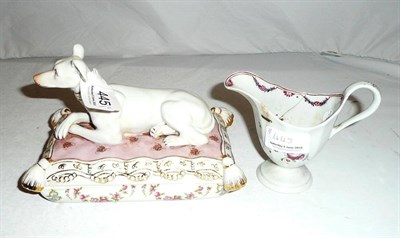 Lot 445 - A German porcelain box and cover set with a recumbent hound and a Newhall-style helmet-shaped cream