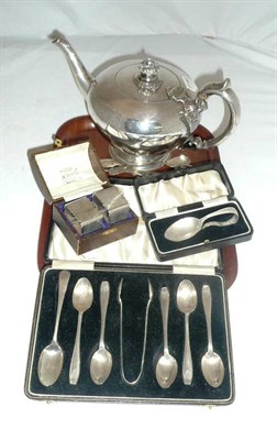 Lot 447 - A pair of napkin rings, a baby spoon, a plate teapot, five teaspoons and tongs, eight spoons, a...