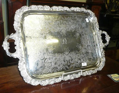 Lot 467 - A large electroplated tray with ornate scroll edge