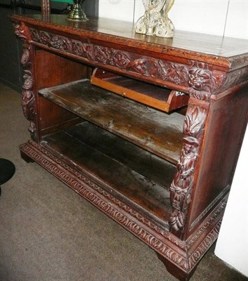 Lot 584 - A Victorian carved oak open bookcase