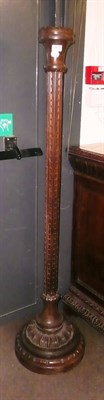 Lot 585 - Carved oak Arts & Crafts standard lamp