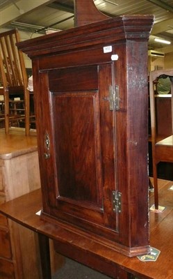 Lot 602 - 18th century panelled oak corner cupboard