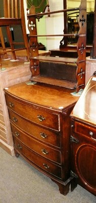 Lot 610 - Walnut bow front four height chest of drawers and open wall shelf (2)