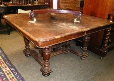 Lot 615 - Continental walnut extending table