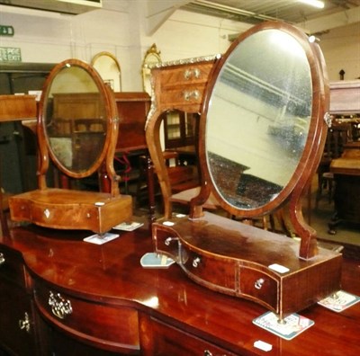 Lot 631 - Two mahogany shield shape dressing table mirrors