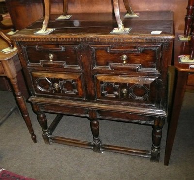 Lot 640 - An oak four drawer chest on stand (17th century and later)