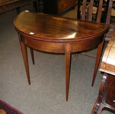 Lot 652 - Mahogany half round table