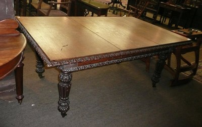 Lot 655 - Oak dining table on carved legs