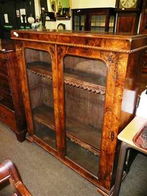 Lot 661 - Victorian walnut inlaid glazed bookcase