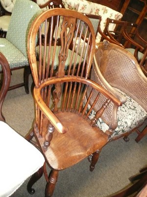 Lot 671 - Yew and elm Windsor chair with a crinoline stretcher