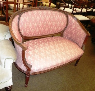 Lot 679 - Small settee upholstered in pink