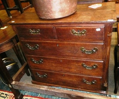 Lot 703 - Oak chest of drawers - brass handles