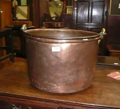 Lot 704 - Large copper pan with a swing handle, a brass coal helmet and a floral table cover