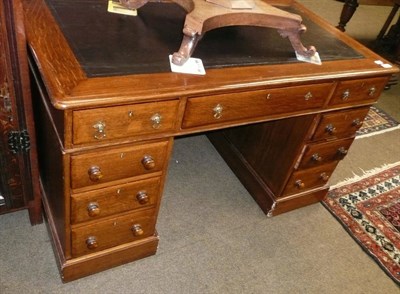 Lot 712 - Edwardian oak pedestal desk