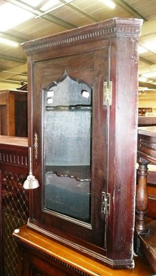 Lot 724 - Georgian mahogany glazed hanging corner cupboard