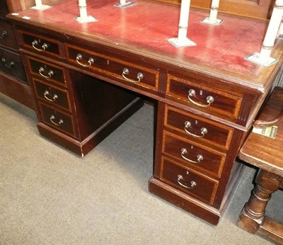 Lot 730 - Mahogany inlaid pedestal desk with red leather top