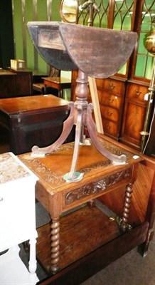 Lot 737 - Carved oak two tier side table and small mahogany drop leaf pedestal occasional table (2)