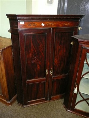 Lot 746 - Georgian mahogany corner wall cupboard