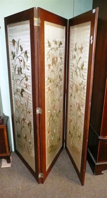 Lot 751 - A needlework three fold screen