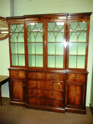 Lot 755 - A reproduction mahogany breakfront bookcase