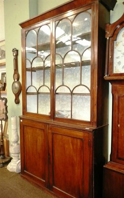 Lot 773 - 19th century mahogany glazed bookcase on cabinet