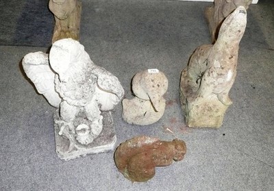 Lot 791 - Four garden animal figures - eagle, kingfisher, a squirrel and a seal