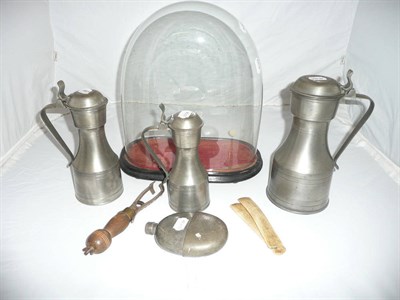 Lot 6 - Three pewter flagons, stay busks and a glass dome