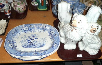 Lot 32 - Two pairs of Staffordshire dogs and pups and three blue and white plates