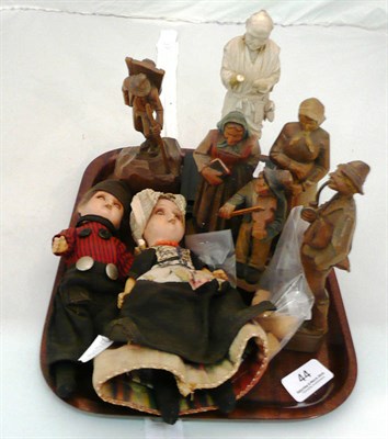 Lot 44 - Carved oriental figure (a.f.), carved wooden figures and two dolls