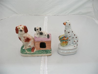 Lot 46 - Dog with basket of flowers and dogs with kennel