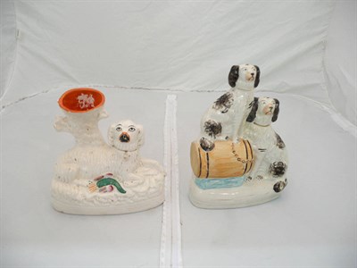 Lot 48 - A dog spill vase and a group of two black and white dogs