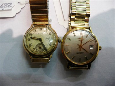 Lot 62 - A gilt and steel gentleman's wristwatch signed Longines, Conquest and case and booklet, and...