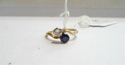 Lot 68 - A sapphire and diamond two stone twist ring