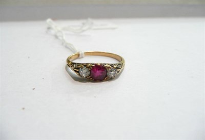 Lot 72 - A ruby and diamond three stone ring