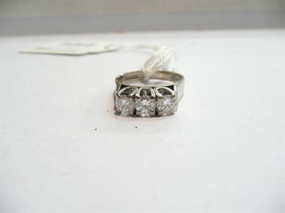 Lot 77 - A diamond three stone ring in 18 carat white gold