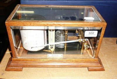 Lot 102 - An Oak Cased Barograph by Ross, London, with eight section vacuum, ivory thermometer, ivorine...