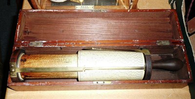 Lot 103 - A Fuller's Calculator or Spiral Slide Rule, with wooden handle and brass fittings, in a...