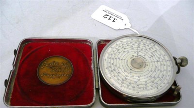 Lot 112 - A Fowler's Patent Calculator, the 6.5cm circular slide rule in chrome with double sided dials -...