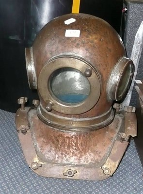 Lot 117 - A Copper and Brass Twelve Bolt Diver's Helmet, stamped with the  number '900', with three...