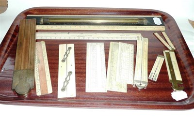 Lot 158 - Nine Ivory Rules, including a folding 24 inch rule with bevelled edges and nickel mounts, a 12 inch