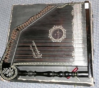 Lot 237 - A Columbia 'Harpenzither' Mandolin Harp, the ebonised body transfer printed with foliate decoration