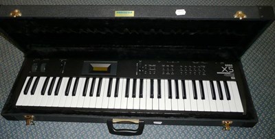 Lot 240 - A Korg X5 Synthesiser, thirty-six key keyboard, complete with stand and fitted hardcase