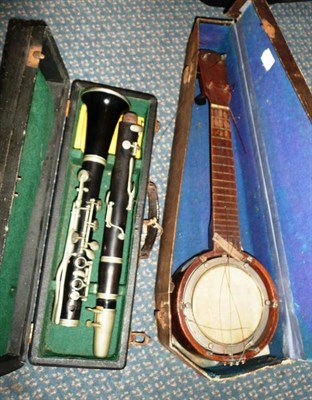 Lot 249 - A Gebruder Henkel "Dresden" Ebony Clarinet, in fitted case; A Ukelele Banjo, cased. (2)